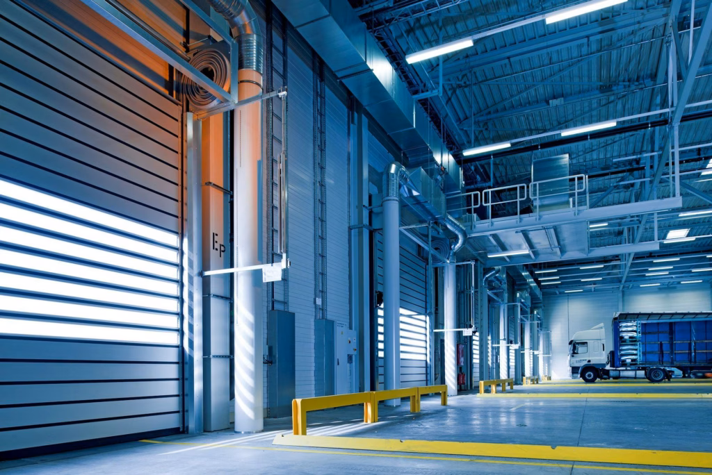 Commercial, maintenance, Spacious and modern warehouse interior with parked truck and steel structures.